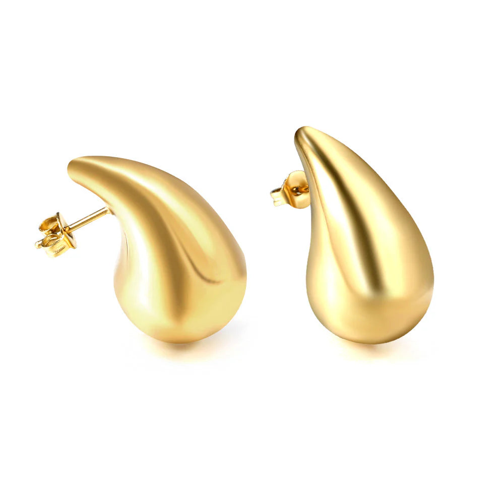 Gold teardrop-shaped earrings on a white background