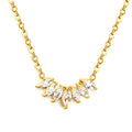 Gold necklace with clear zirconia diamond gemstones on a white background