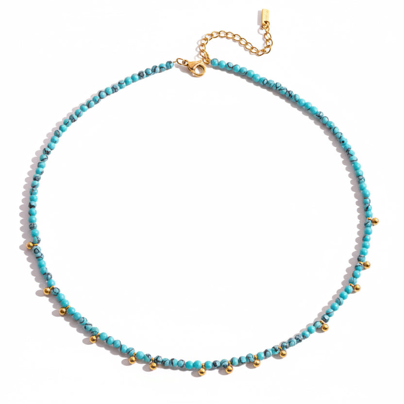 Necklace with blue turquoise stone beads and gold accents white background. turquoise bead necklace gold, gold bead necklace, beach jewelry necklace