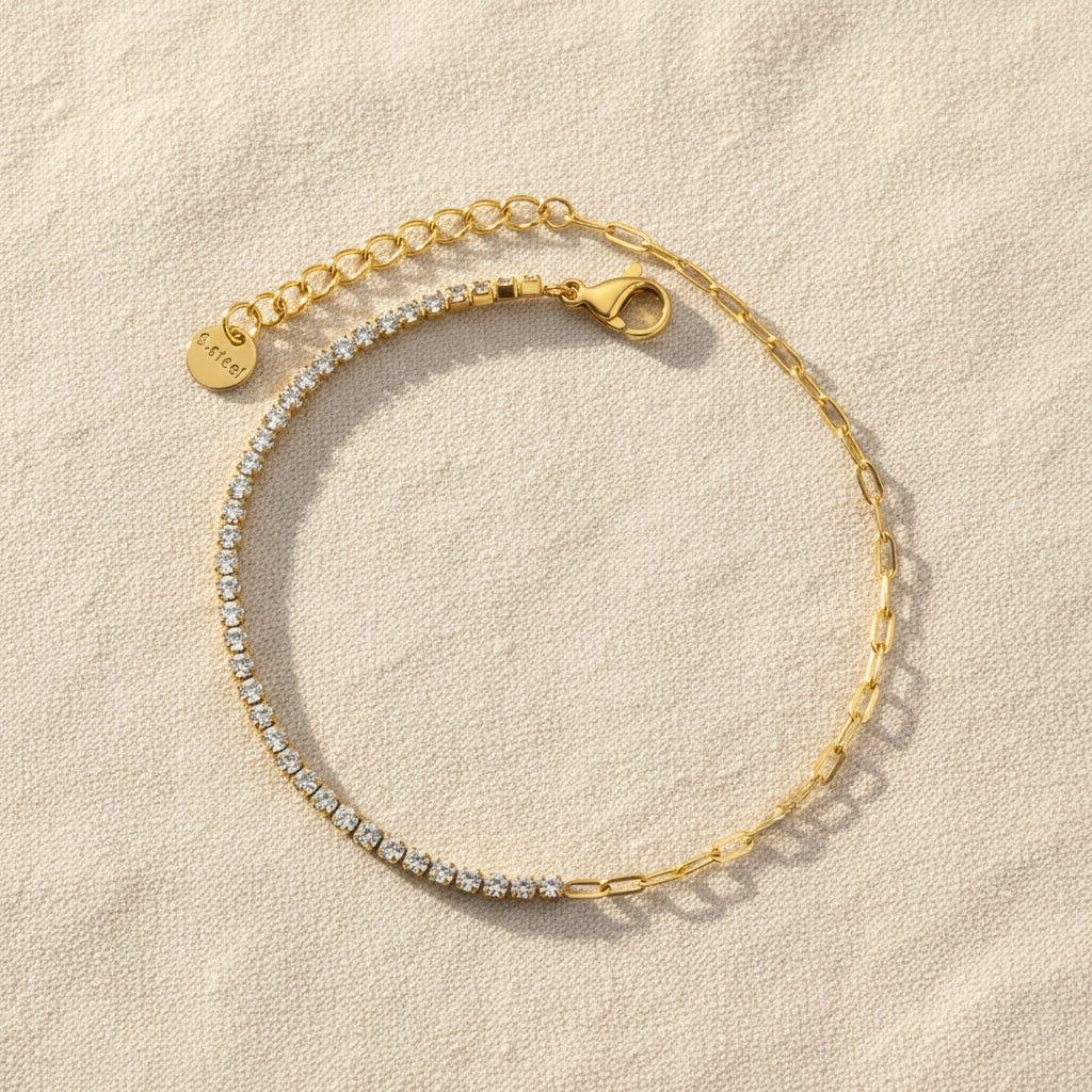 Gold bracelet with zirconia diamond stones on a white background