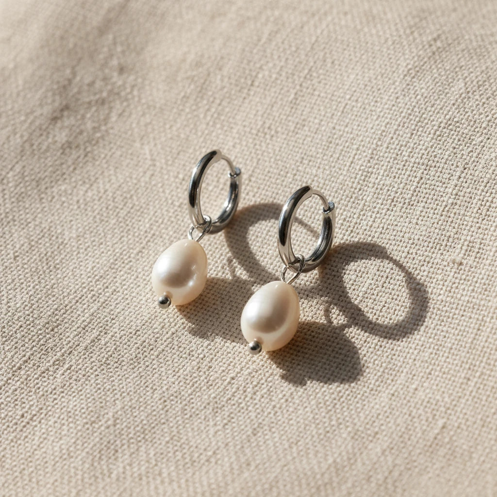 Silver hoop earrings with white pearls on a white background. Pearl drop huggie earrings gold, pearl hoop earrings, dainty gold earrings