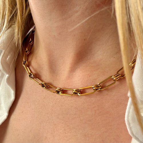 Gold link chain necklace worn by a woman. paperclip chain necklace gold, link and circle necklace, modern gold necklace