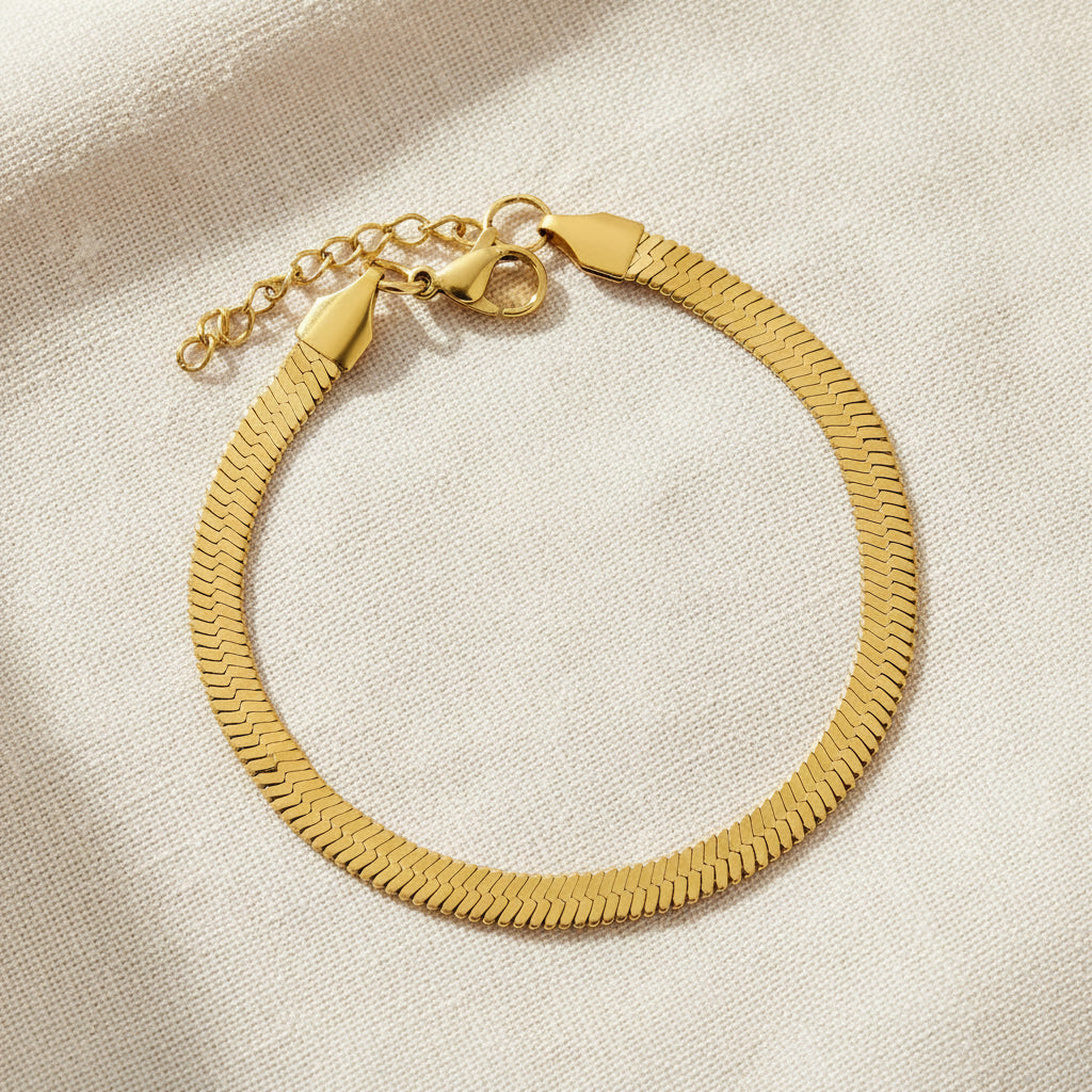 Gold herringbone bracelet on a white background. gold herringbone bracelet, flat chain bracelet, minimalist gold bracelet