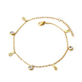 Gold anklet with pineapple and round zirconia charm on a white background