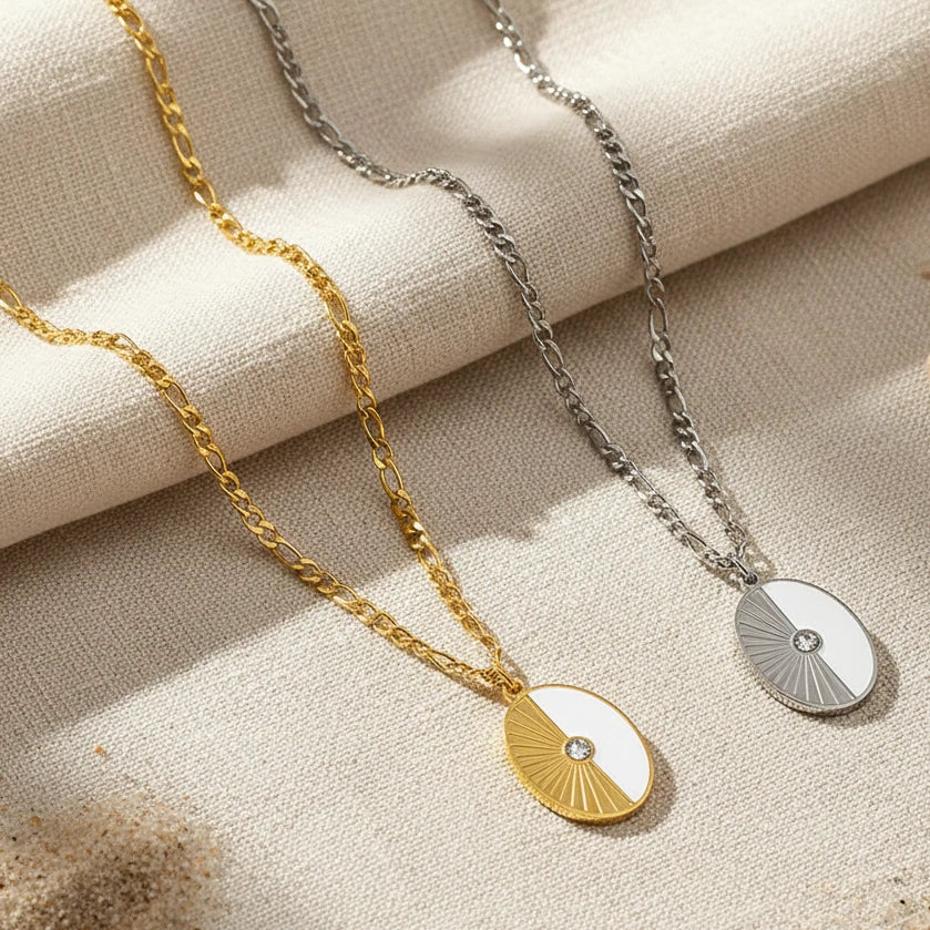 Two necklaces with circular pendants half shell on a white surface. oval shell pendant necklace gold, shell necklace, beach pendant necklace