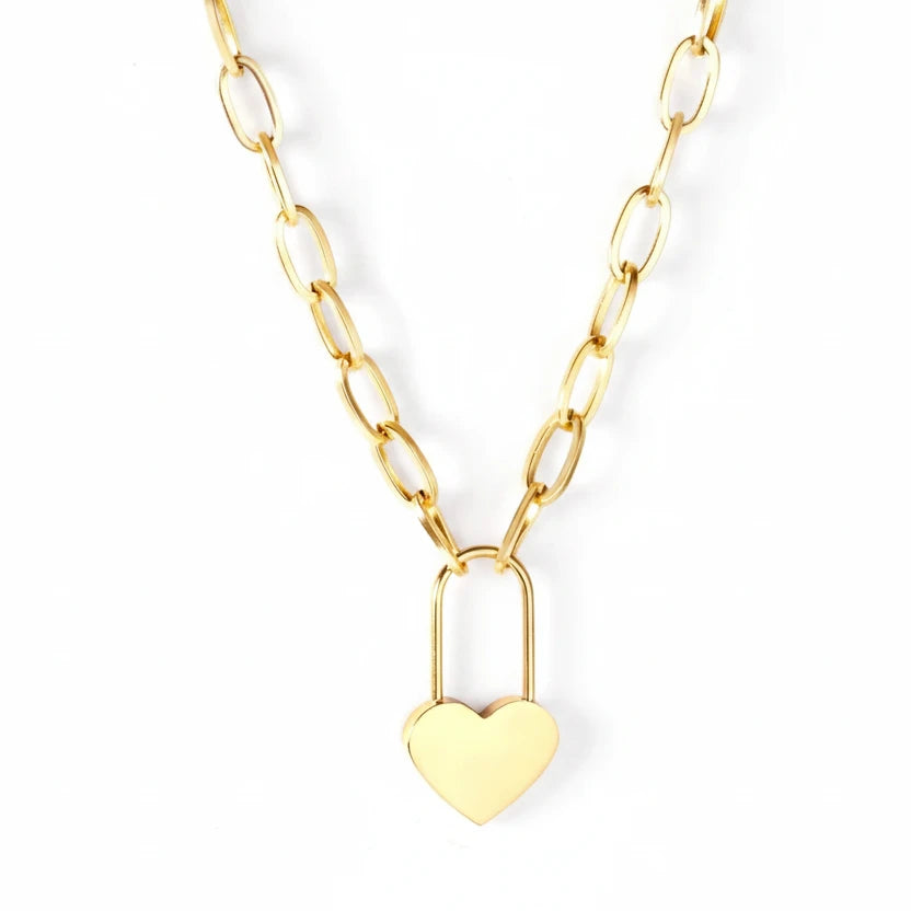 Gold heart-shaped lock necklace on a white background 