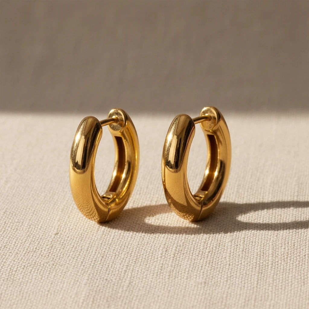 Gold hoop earrings on a white background