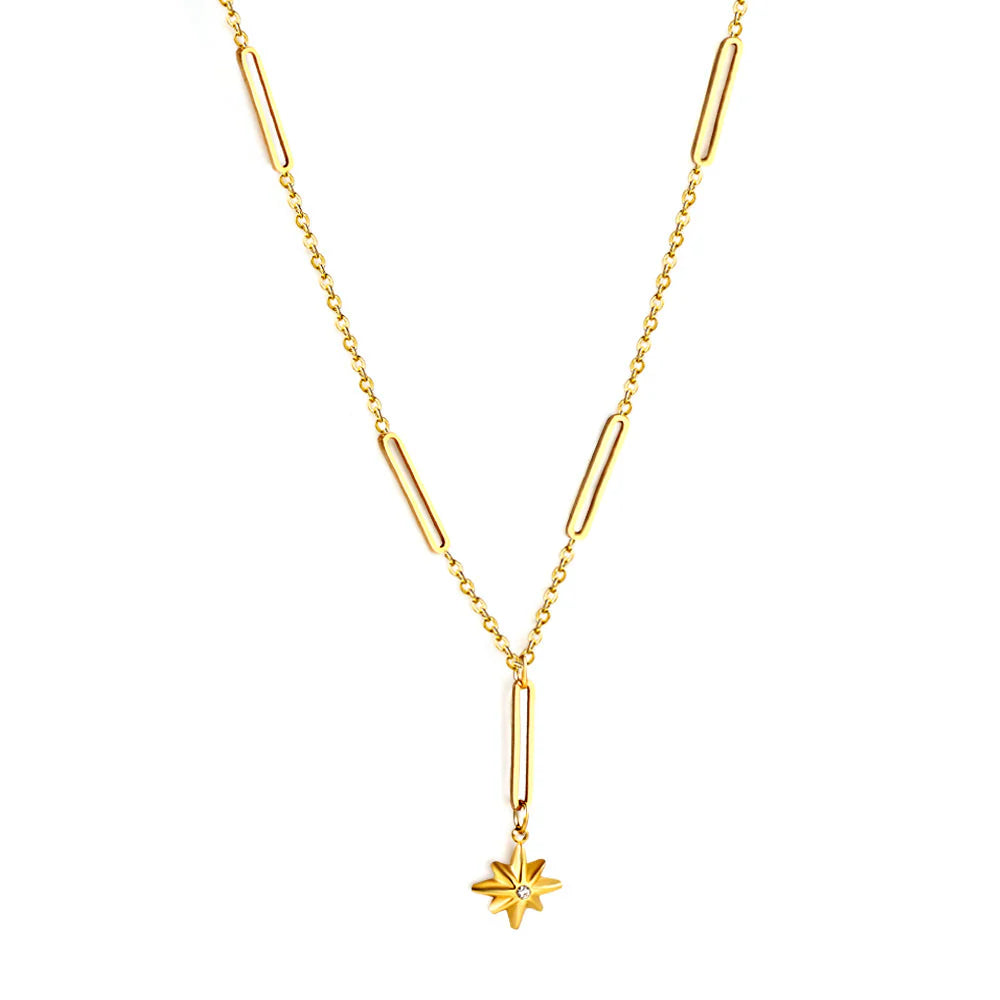 Gold necklace with a star pendant on a white background