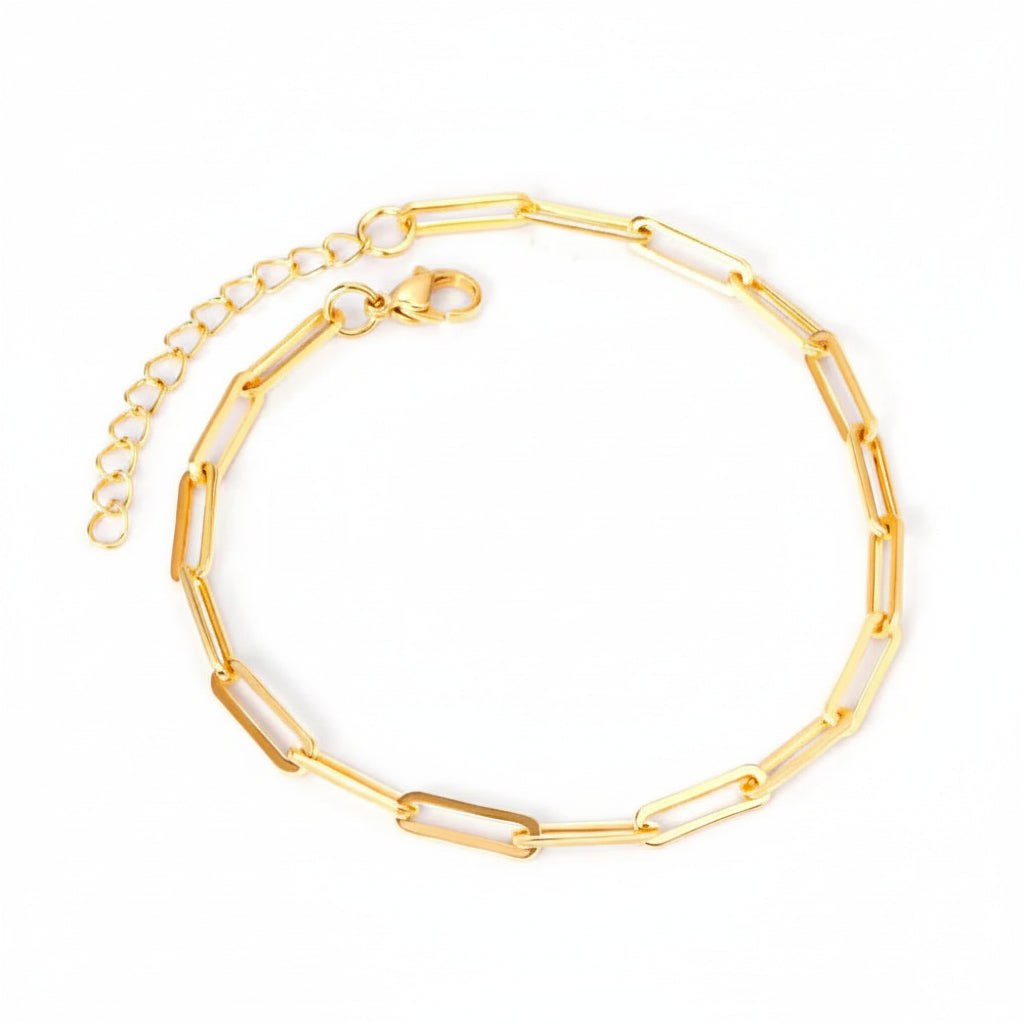 Gold anklet on a white background. Beach jewelry, stainless steel anklet, minimalist jewelry