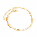 Gold anklet on a white background. Beach jewelry, stainless steel anklet, minimalist jewelry