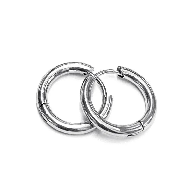 Pair of silver hoop earrings on a white background. Classic hoops, minimalist hoops, everyday stainless steel earrings