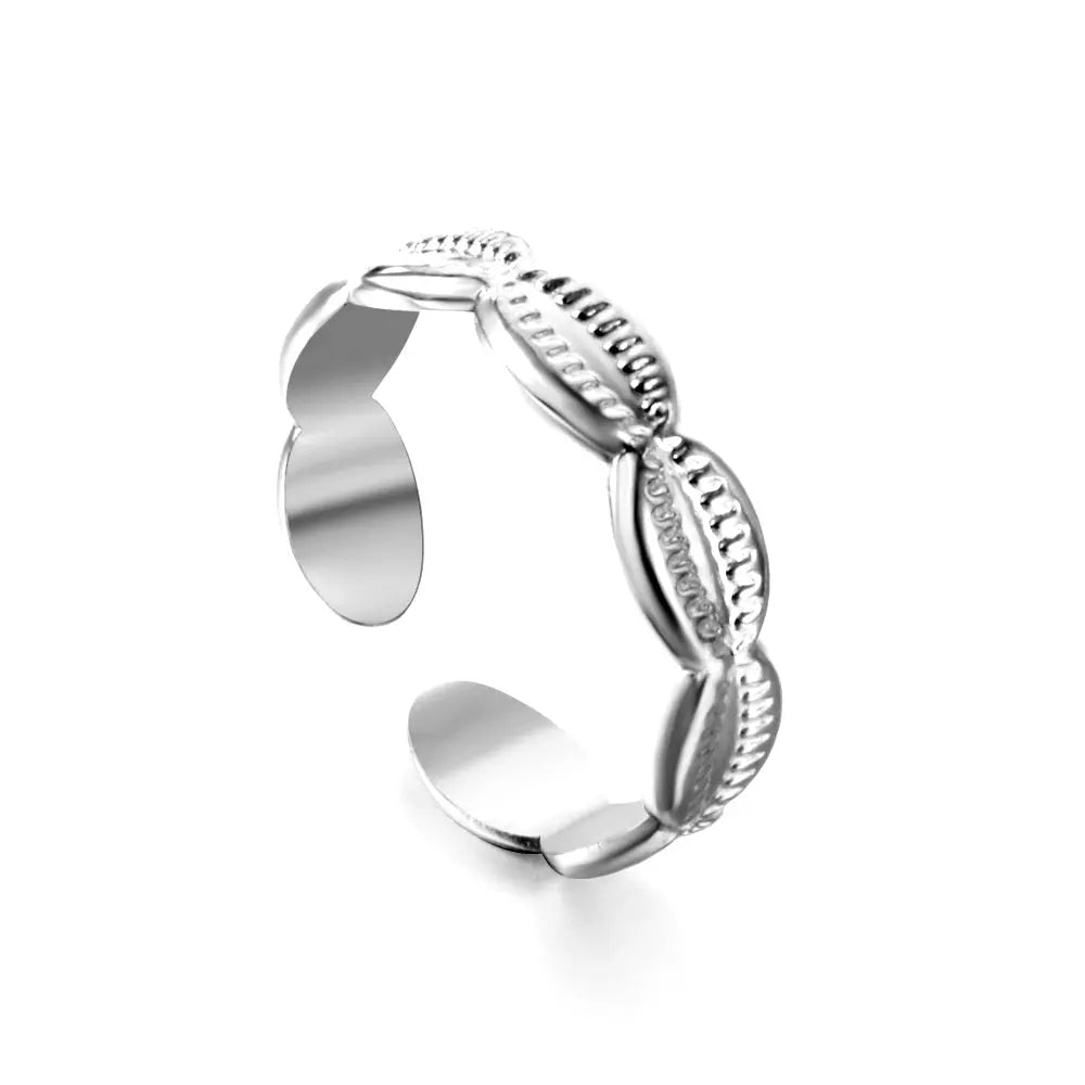 Silver open ring with conch shell design on a white background